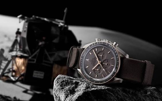 Chronograph watch worn with a tailored sleeve